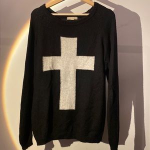 black sweater with white cross
